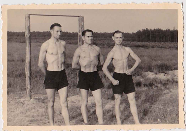 vintage gay photo Good looking trio of young guys pose wearing only their dark shorts.