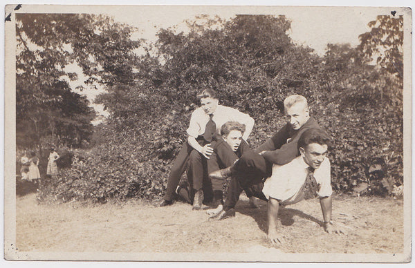 Four Guys Goofing Off vintage Real Photo Postcard c. 1920.