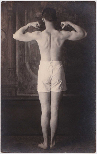 Unusual lot of two Real Photo Postcards shows a young man identified as "Uncle Vern" flexing his biceps.
