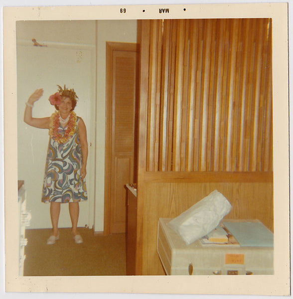 Waving Woman with Leis vintage snapshot