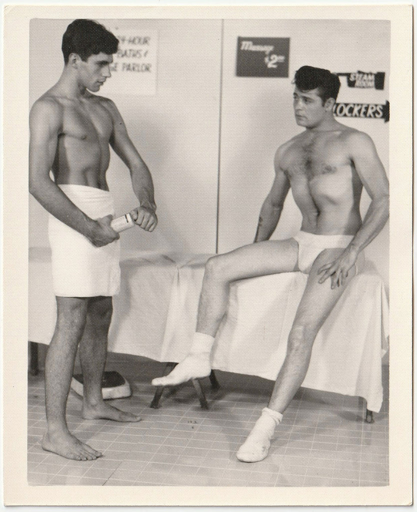 Original vintage gay photo of two nearly naked guys deciding who's going to massage who. By Chuck Renslow - Kris Studio, Chicago.