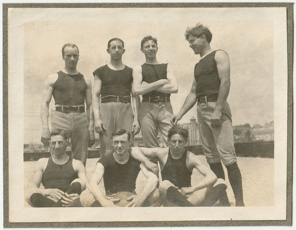 Vintage photo of a basketball team posing on the roof.