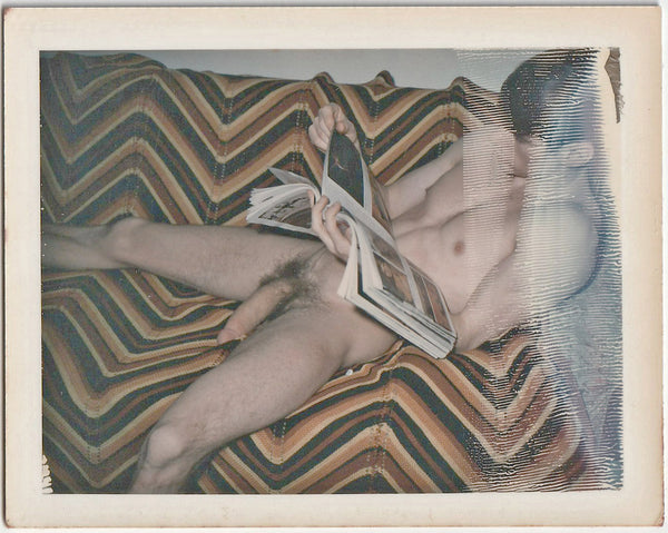 Male Nude Bill Eld Looking at Magazine