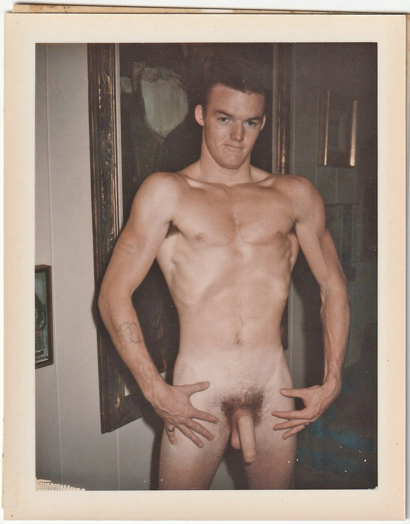 Male nude holds his breath as he does a vacuum pose. Vintage gay Polaroid c. 1960s.