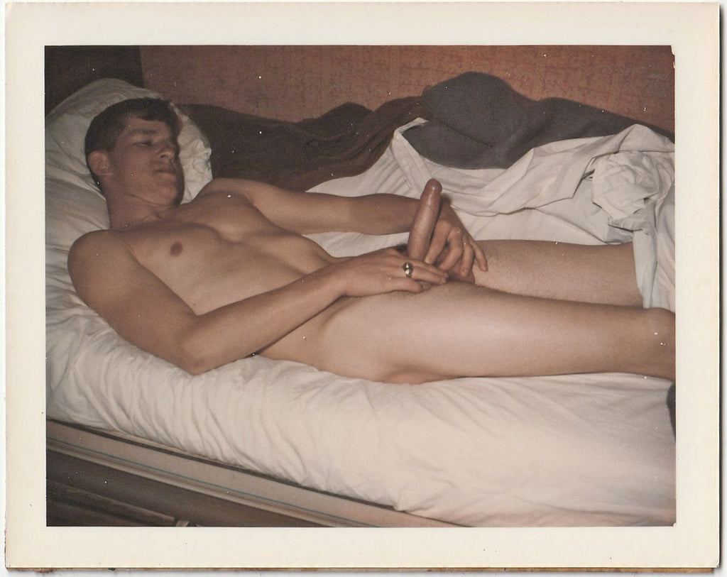 Vintage gay Polaroid Male nude lies in bed showing off his erection for the good Doctor.