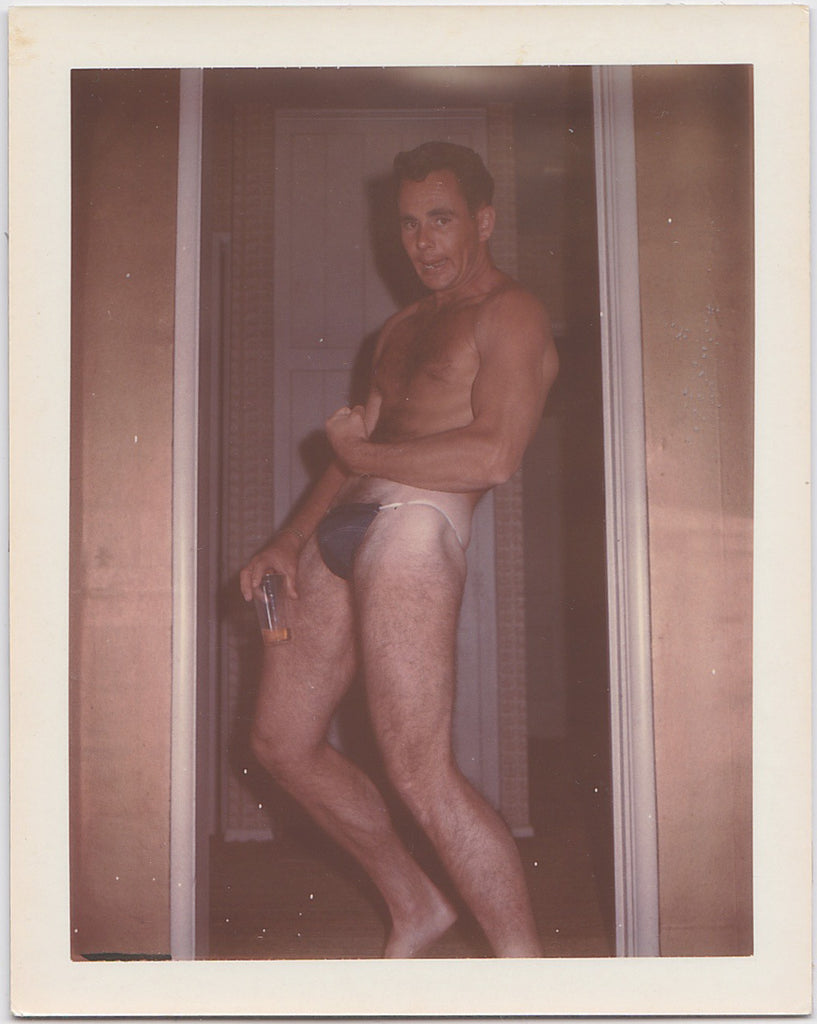 Man Drinking and Flexing vintage gay Polaroid 1965.