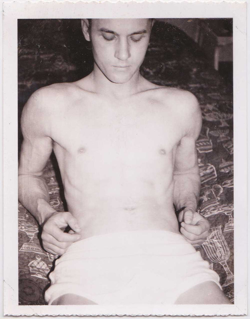 Vintage gay Polaroid male nude on bed
