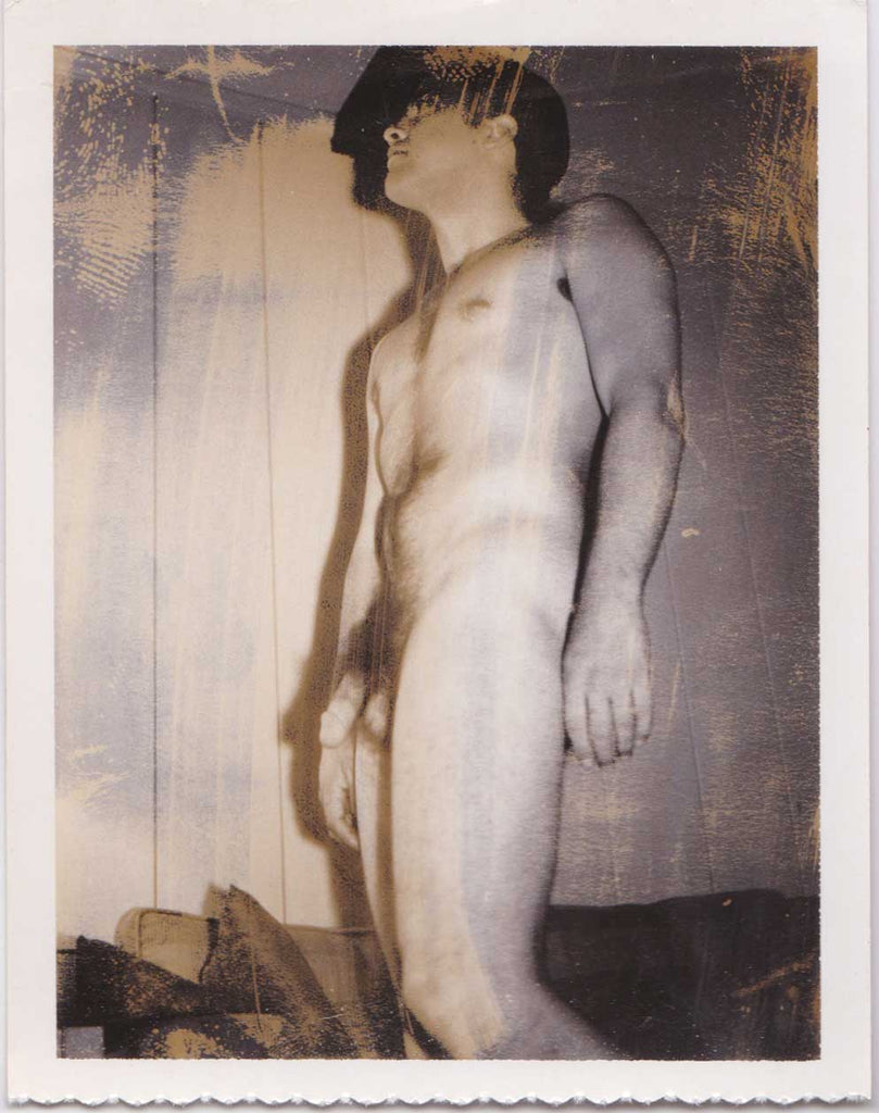 Vintage gay Polaroid Naked man shot from a low angle.