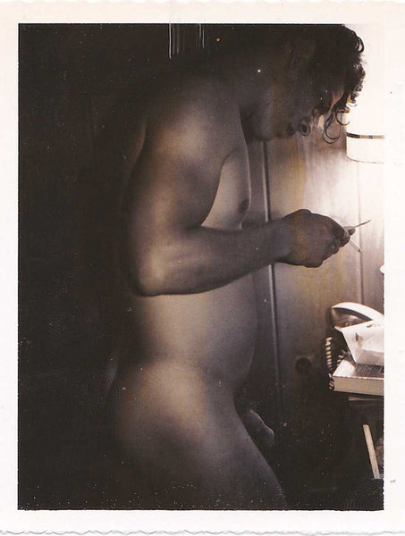 Male Nude Looking at Polaroid vintage gay photo.