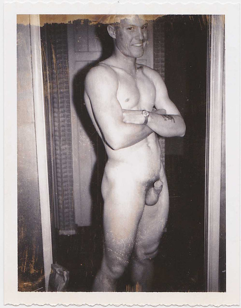 Vintage gay Polaroid Handsome muscular male nude standing in the doorway