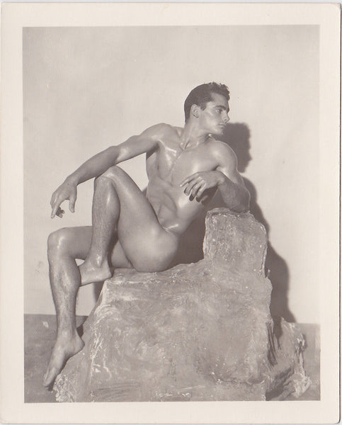 male nude, Forrester Millard, seated on a fake boulder. Vintage physique photo.