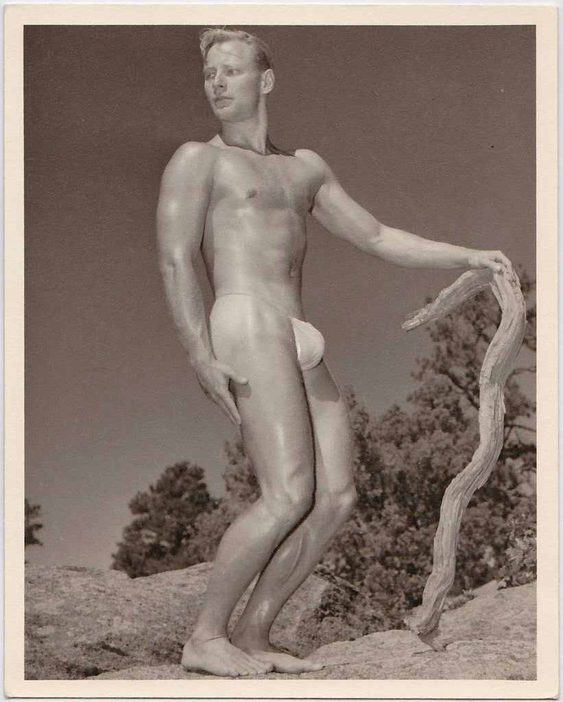 Vintage gay photo by Don Whitman / Western Photography Guild. Looks like he has a softball tucked into his posing strap.