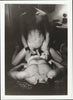 Vintage gay photo Moody and intimate COLT Studio photo of two men on a bed.  From pack H-23, "Threesome"