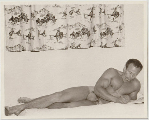 Western Photo Guild: Bodybuilder Reading vintage gay physique photo