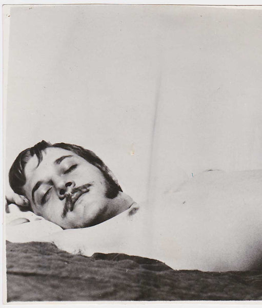 Vintage gay photo of a handsome guy with mustache, long sideburns and an impressive erection.