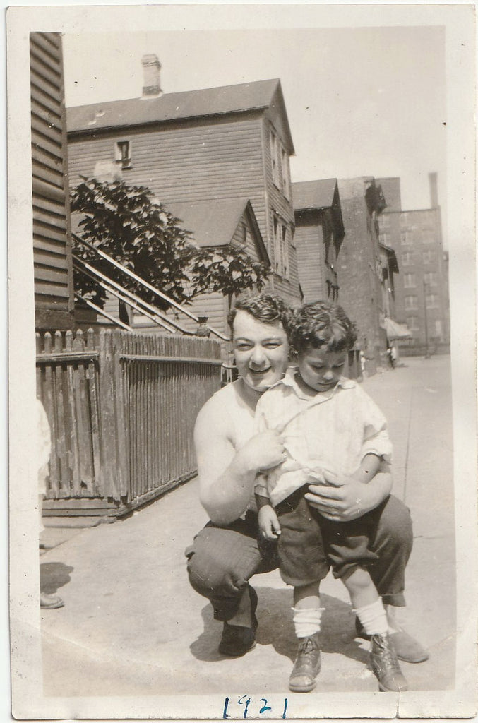 Father and Son on Sidewalk