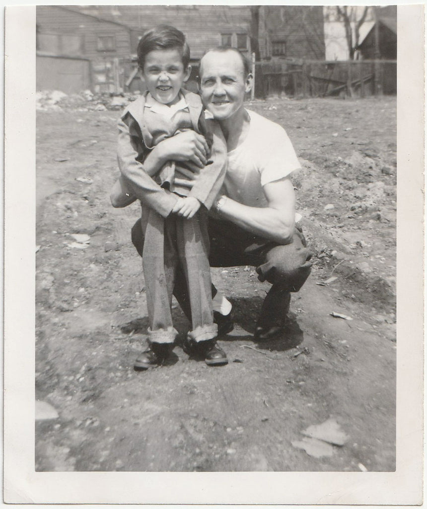 Father and Son in Dirt Yard