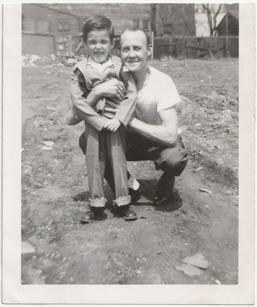 Father and Son in Dirt Yard