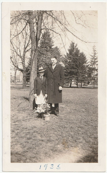 Father and Son with Potted Plants