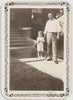 Father and Son with Garden Hose