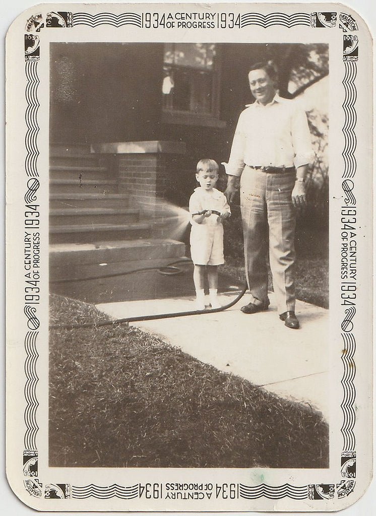 Father and Son with Garden Hose