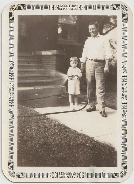 Father and Son with Garden Hose