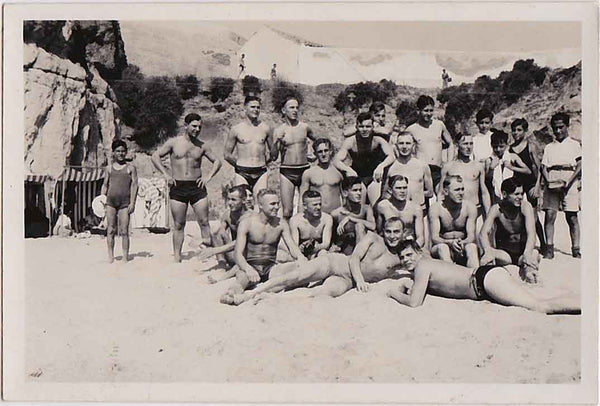 Vintage snapshot Group of guys and a few kids enjoying the sunshine on the beach in Lagos, Portugal.