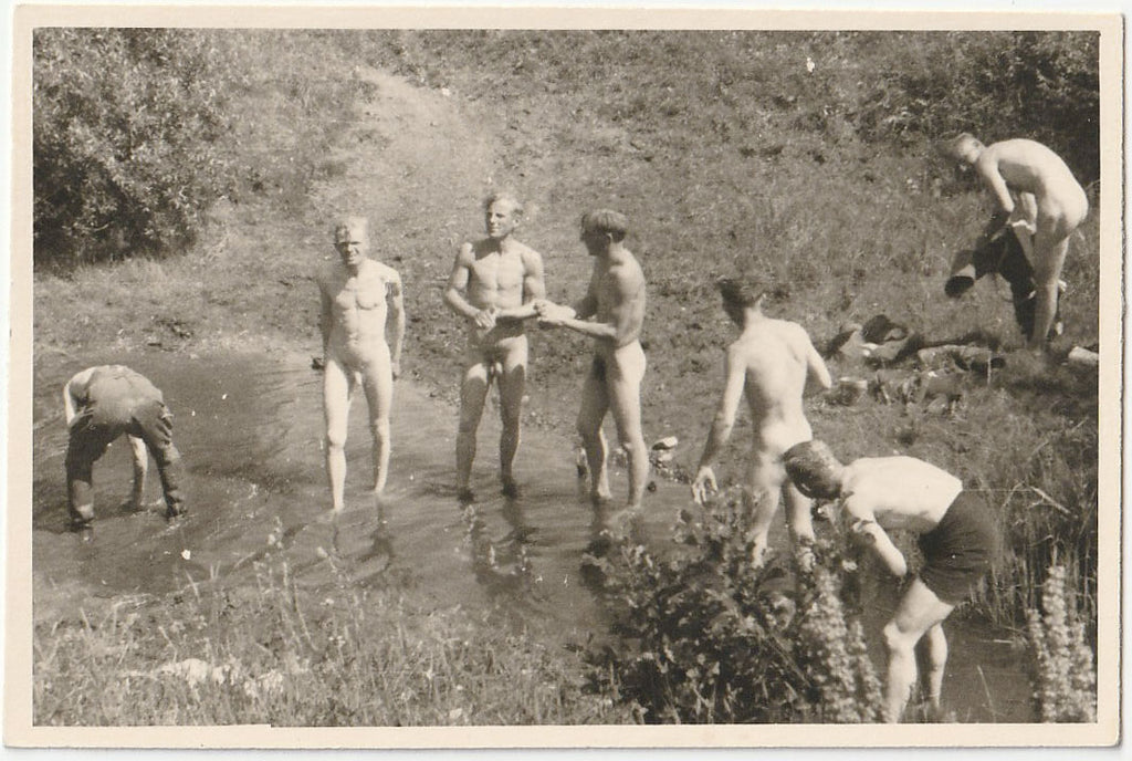 Vintage gay snapshot Guys trying to bathe in ankle-deep water.
