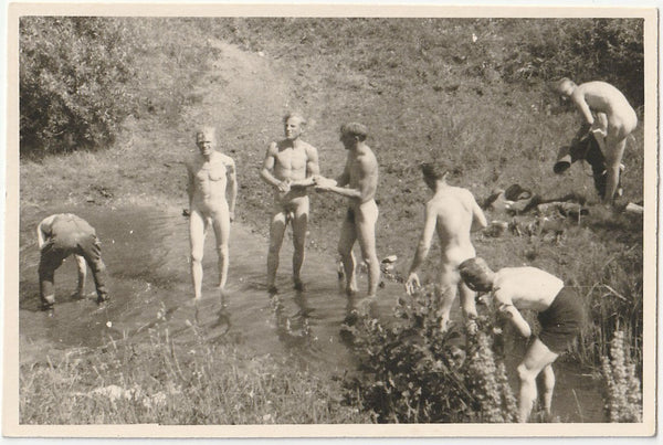 Vintage gay snapshot Guys trying to bathe in ankle-deep water.