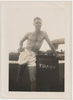 Jimmie at Daytona Beach standing next to trash bin. Vintage gay photo 1946