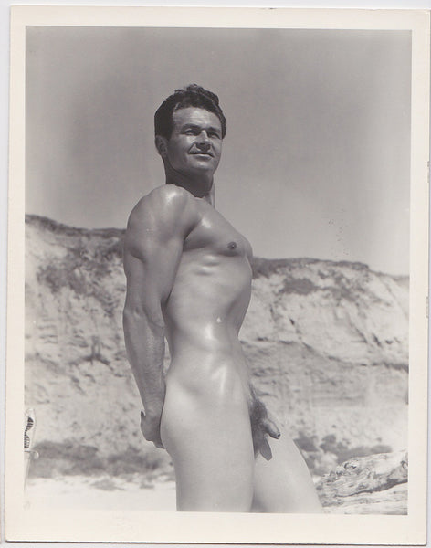 Handsome Keith Stephen flexes on the beach in this vintage physique photo attributed to Bruce of LA.