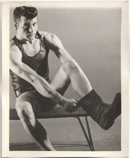 Leather Man Pulling on Boot: Kris Studio vintage gay photo