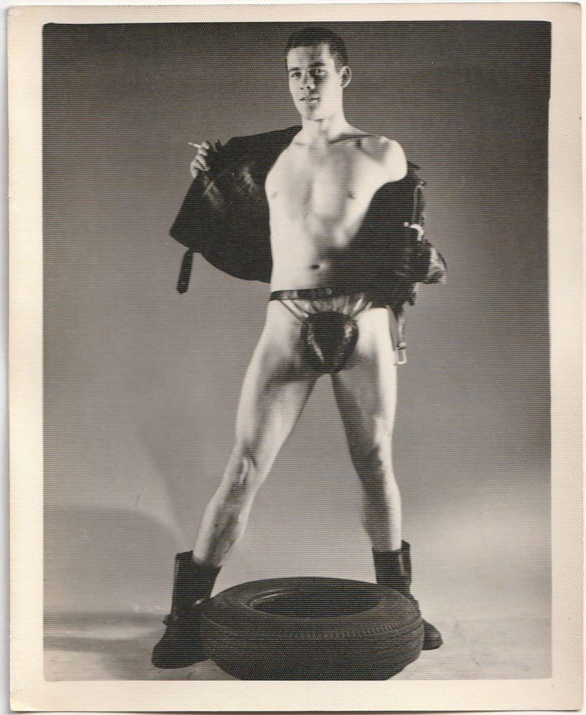 Original vintage photo of an unidentified model wearing a unique leather and chain posing strap or codpiece. By Kris Studio, Chicago