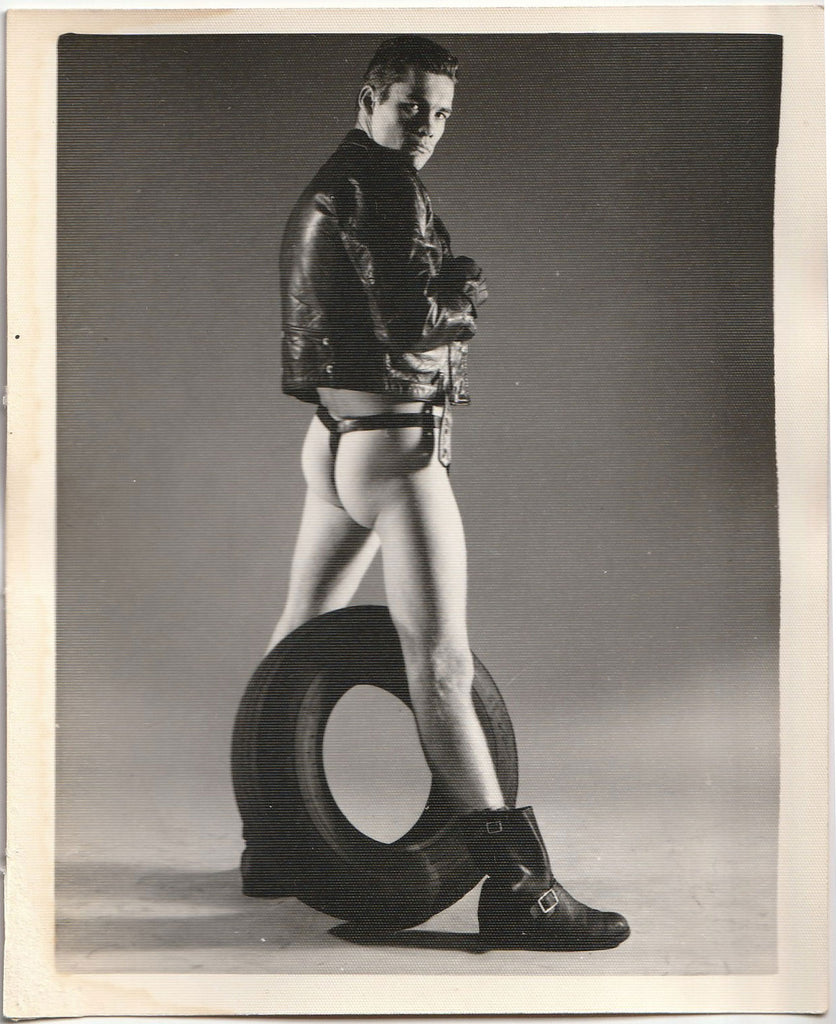 Leather Man Straddling Tire: Kris Studio vintage gay physique photo