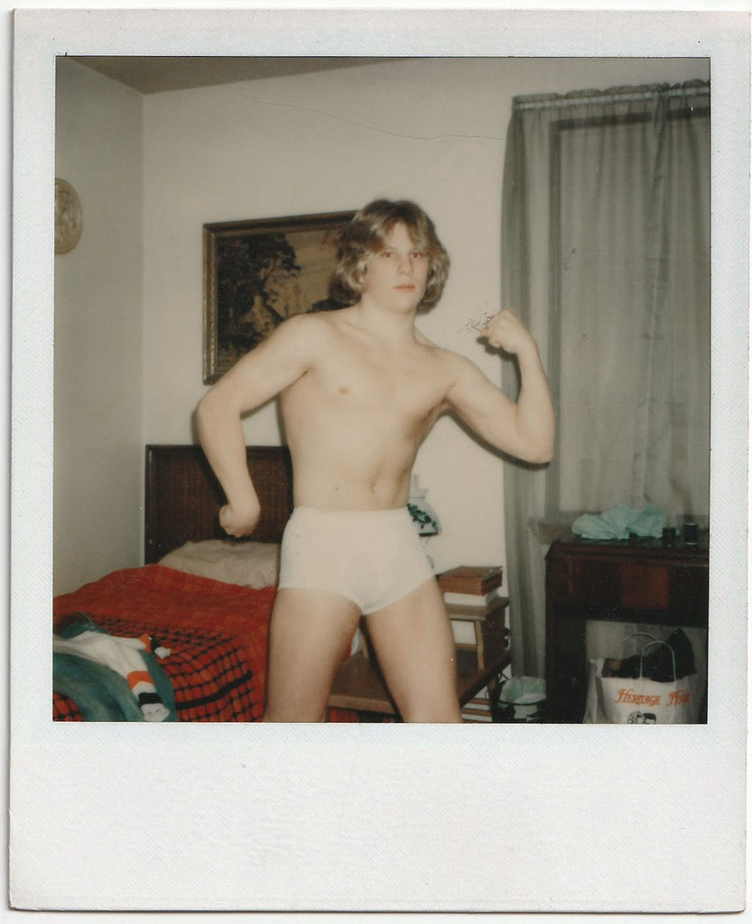 Long-haired Guy in Tighty-whities flexing in his bedroom