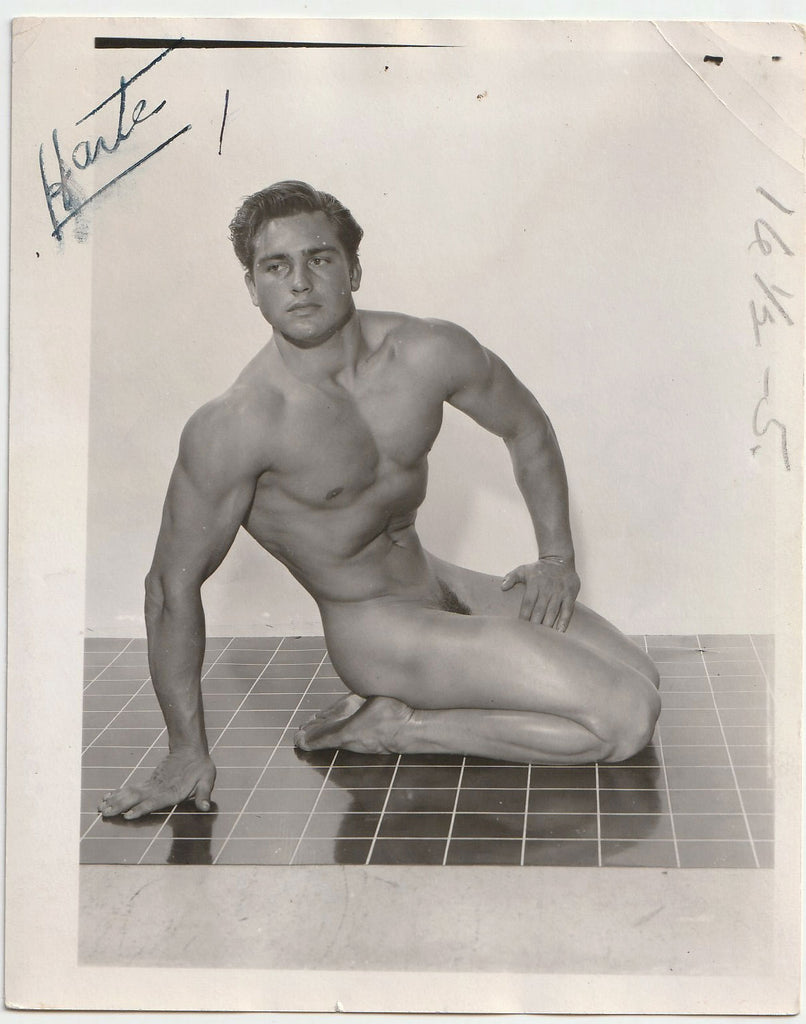 Handsome square-jawed muscular guy identified as "Harte" in a modified "Hero" pose vintage gay photo