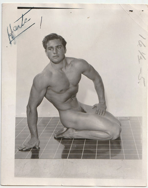 Handsome square-jawed muscular guy identified as "Harte" in a modified "Hero" pose vintage gay photo