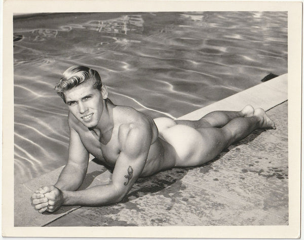 Vintage gay physique photo David Zurborg lying next to swimming pool, Bruce of LA