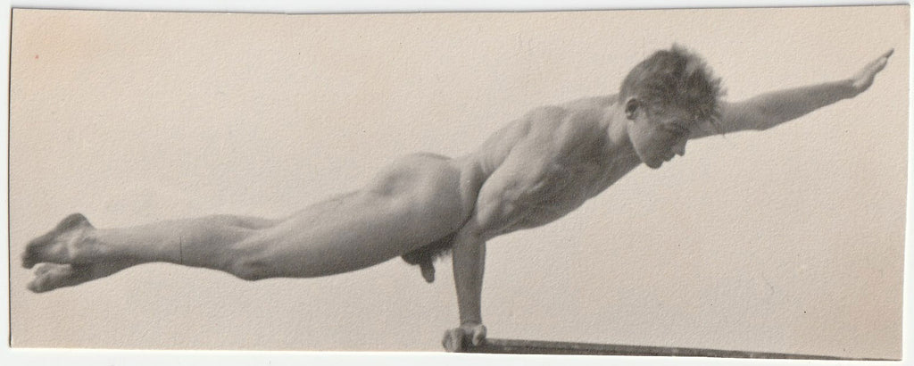 Lot of two photos of a nude athlete doing a one-arm plank and standing with a fringed fabric on the beach.