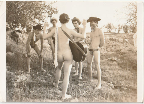 Vintage gay photo Strange and wonderful image of four young cowboys holding up a bare-butted guitar player. 