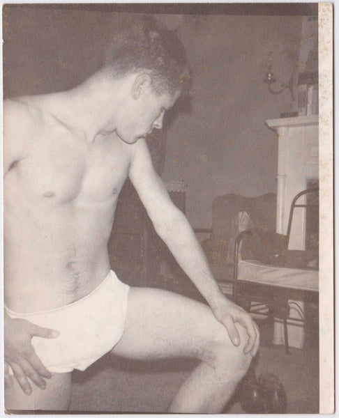 Lithe young guy stands in his underwear in the Living Room. vintage gay photo