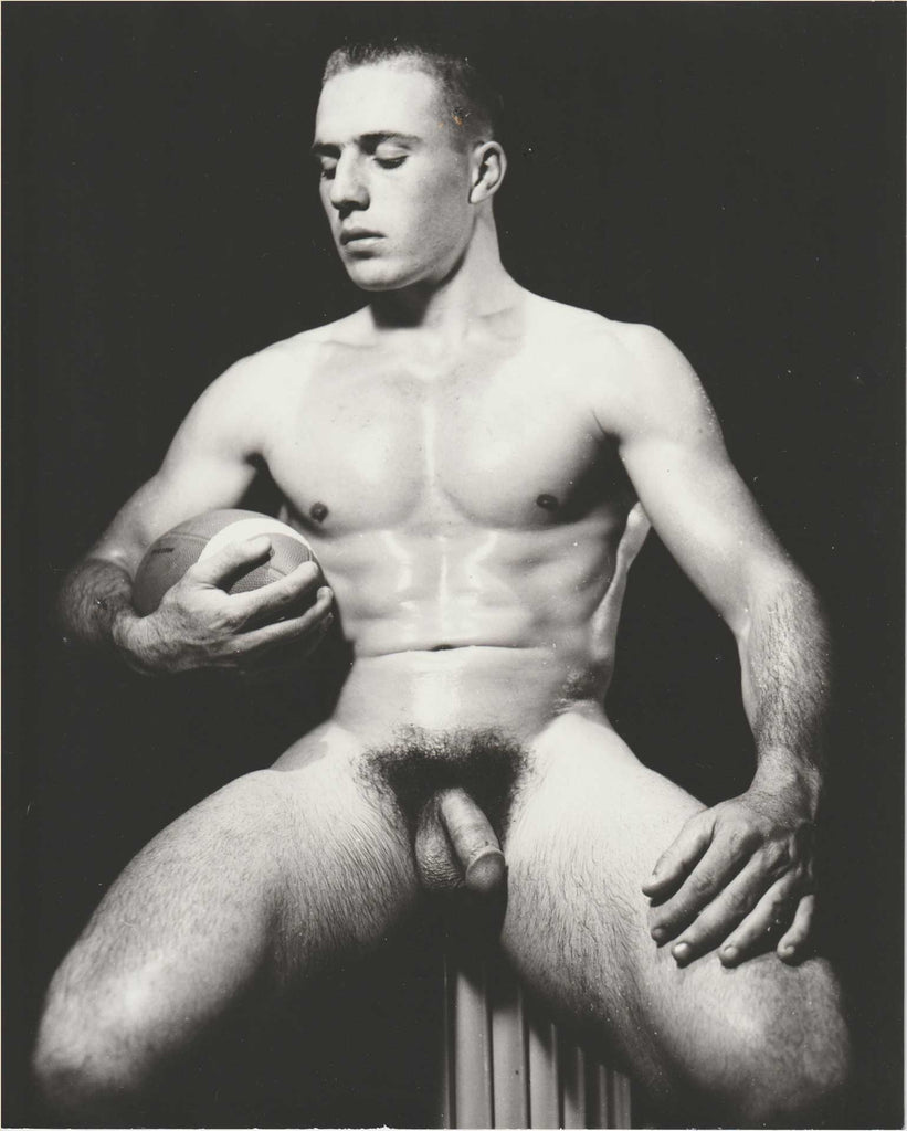 Original vintage photo by Dave Martin of ruggedly handsome Don Detata holding a football