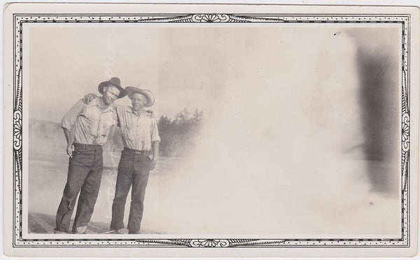father and son with arms draped on each other's shoulders vintage snapshot