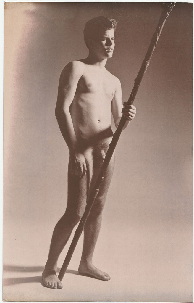 Stunning large format sepia photo of a male nude holding a wooden pole.
