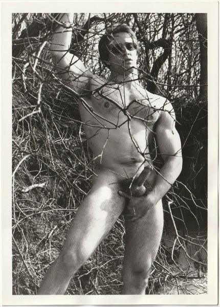 Handsome Bruce Steele stands naked in the woods. Target Studios vintage gay photo.