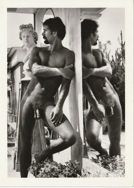 Vintage Target Studios male nude photo- "Brand" leaning next to mirror.