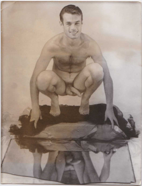 Vintage gay photo Handsome model Yves Le Cadou reflected in a broken mirror.