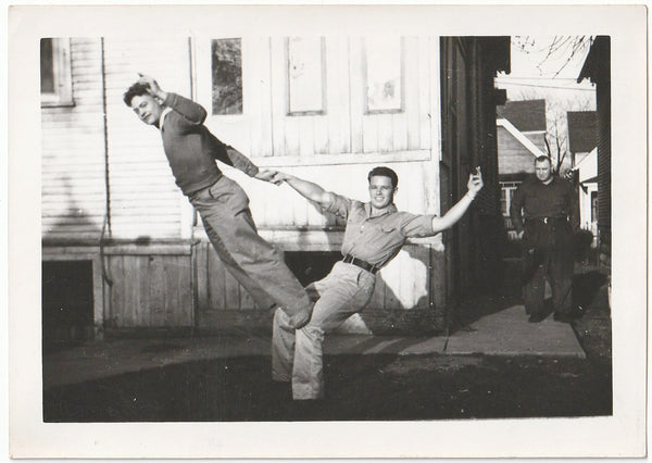 Vintage photo c. 1940s Handsome muscled bottom man smiles for the camera as he holds the top guy.