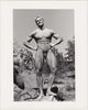 Beautifully printed photo of a handsome, smiling bodybuilder posing naked in the Southern California scrub. "Paul Burkhart, San Diego, Calif." 