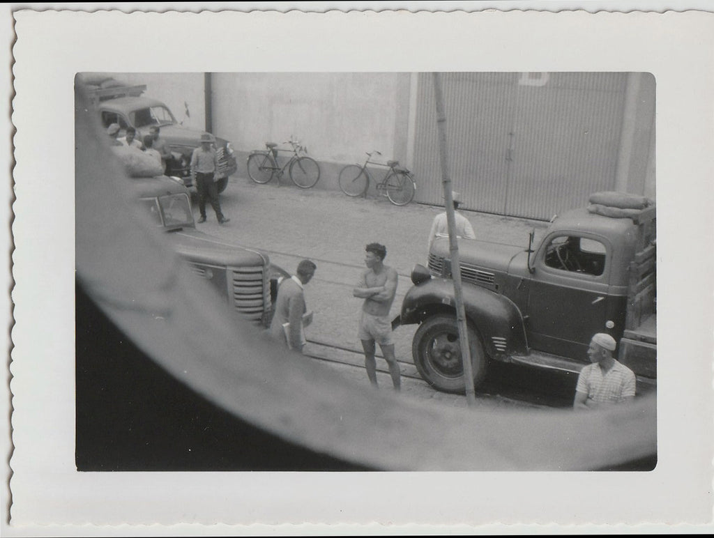 Interesting composition, likely the Port of New Orleans seen from above, centered on a muscular guy wearing shorts vintage snapshot